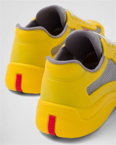 white canvas prada shoes with navy stripes and yellow lining